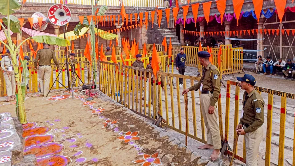 Police personnel stand guard during preparations for Saraswati Puja at the disputed Bhojshala complex, revered as Saraswati temple, on the eve of Basant Panchami, in Dhar, Madhya Pradesh, Thursday, Jan. 22, 2026.
