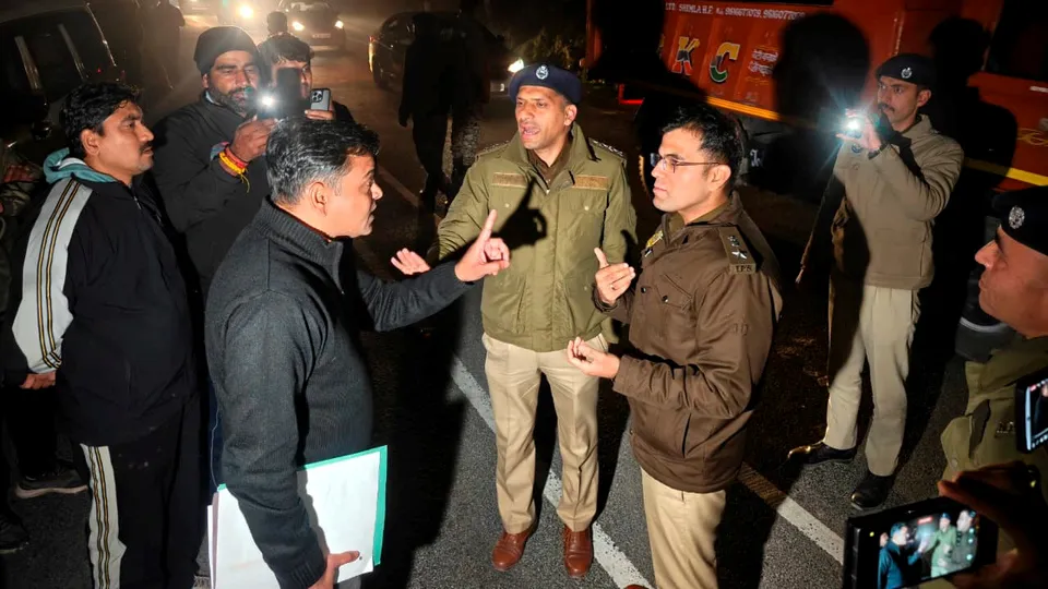Police officials from Delhi and Shimla in a conversation, in Shimla, Wednesday, Feb. 25, 2026.