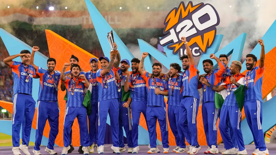 Suryakumar Yadav and teammates celebrate with the tournament trophy during the presentation ceremony after winning the ICC Men's T20 World Cup 2026, at Narendra Modi Stadium, in Ahmedabad, Gujarat, Sunday, March 8, 2026.