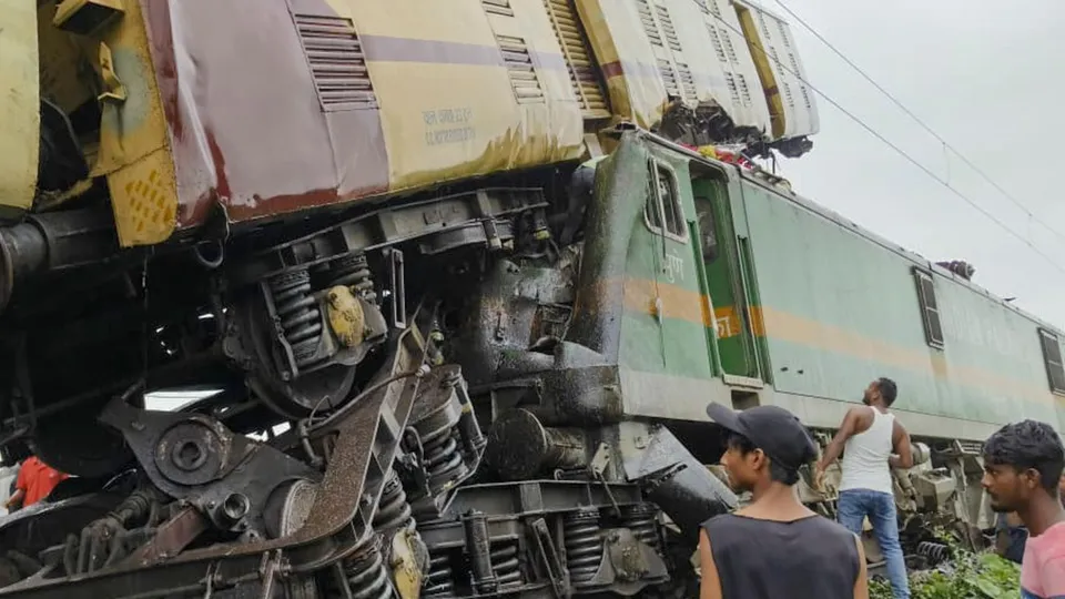 Locals gather after a collision between the Kanchanjungha Express and a goods train, near Rangapani railway station, on Monday, June 17, 2024.