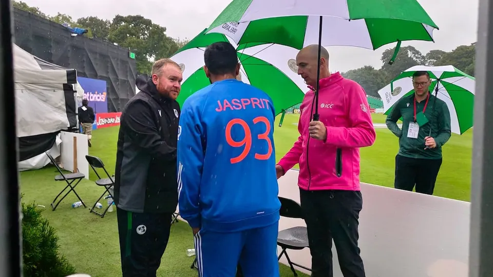 The two captains shake hands as the play is called off due to incessant rains