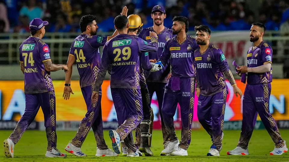 KKR's bowler Varun Chakravarthy with teammates celebrates the wicket of DC' Captain Rishabh Pant during the IPL 2024