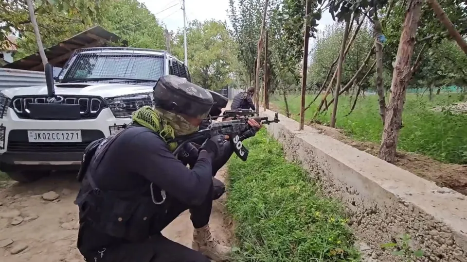 Security personnel during an encounter with militants at Chak Tapper Kreeri Pattan area, in Baramulla district, Jammu and Kashmir, Saturday, Sept. 14, 2024