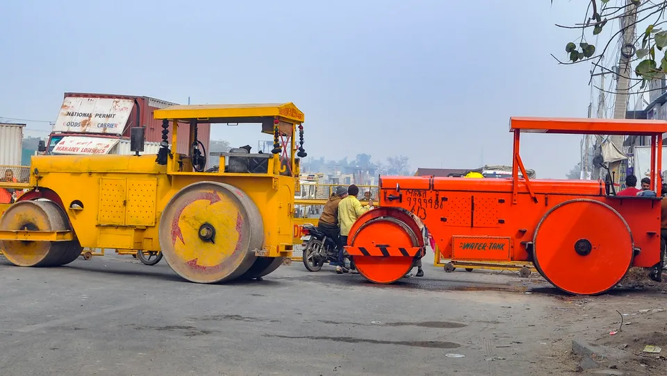 Road rollers, acting as a barricade, parked near Singhu border in view of farmers' 'Delhi Chalo March',