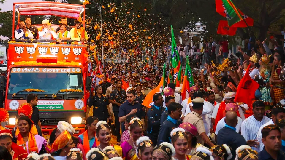 Prime Minister Narendra Modi during a roadshow ahead of the Karnataka Assembly elections in Mysuru on April 30