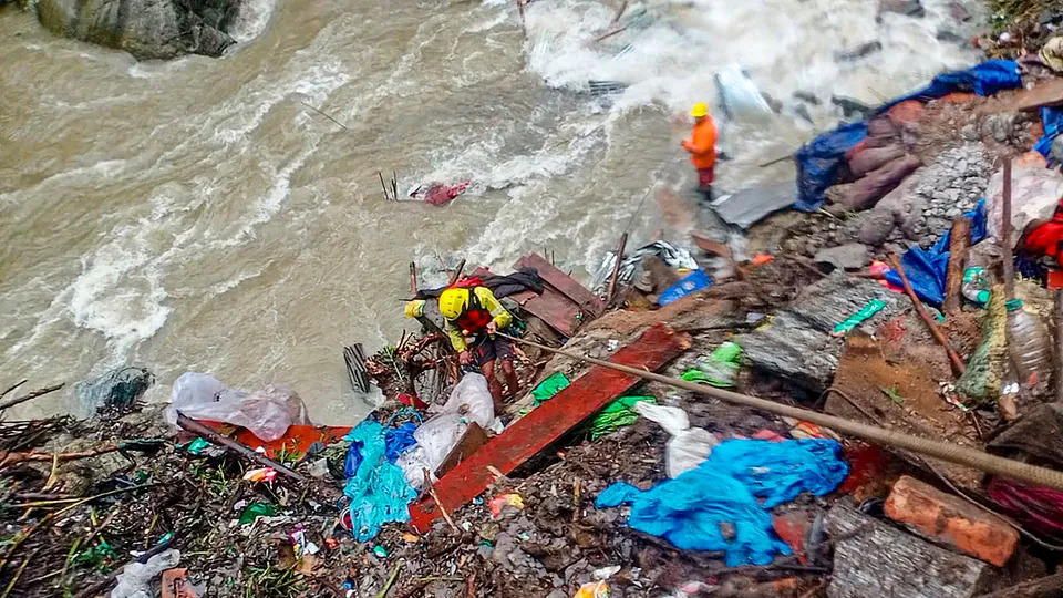 NDRF and SDRF personnel conduct rescue and search operation following a landslide due to rains at Gaurikund in Rudraprayag