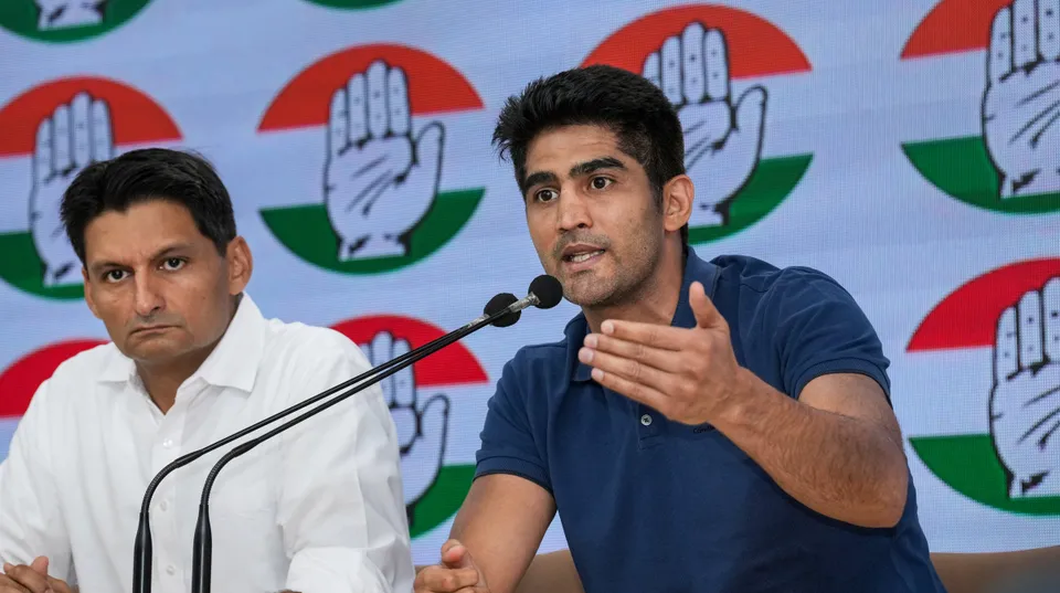 Congress leaders Vijender Singh and Deepender Hooda address a press conference at AICC headquarters, in New Delhi