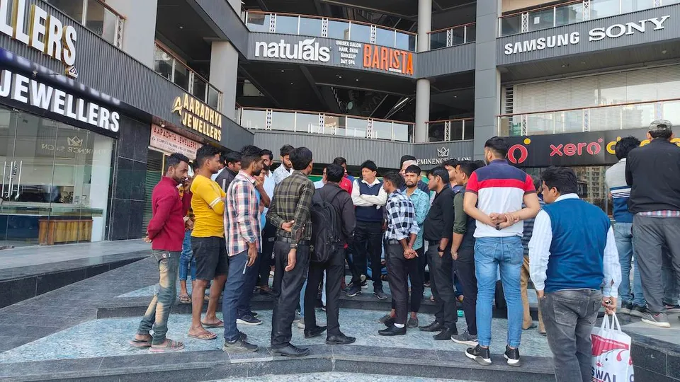 Visitors at the Galaxy Blue Sapphire Mall, where two men died on Sunday, March 3, 2024, allegedly after an iron grille fell on them from the fifth floor, in Noida Extension.