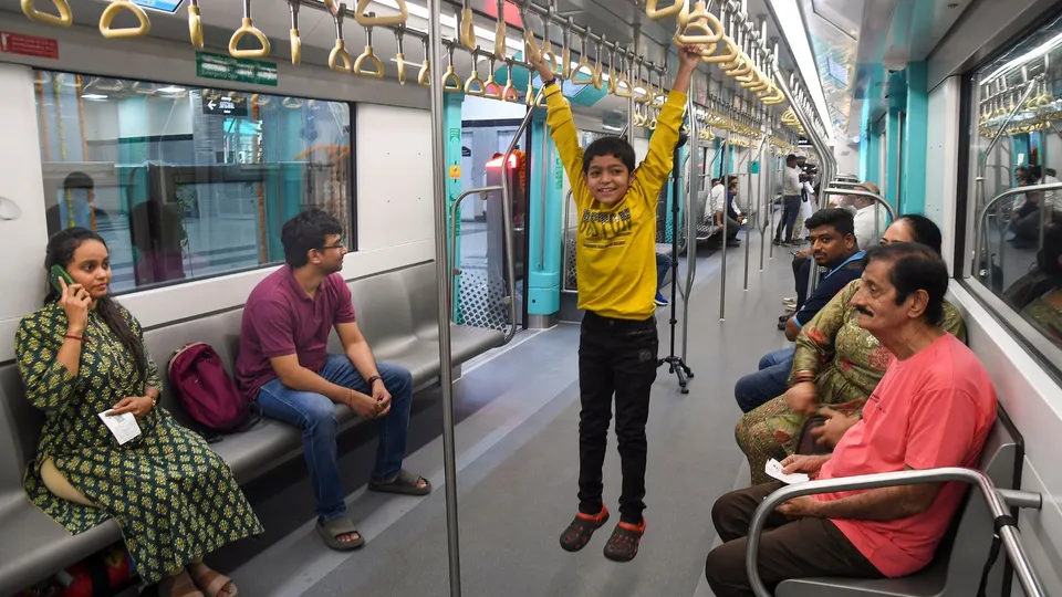 People ride a metro on the Bandra Kurla Complex (BKC) to Aarey underground section of Mumbai Metro Line 3 after it was opened for public, in Mumbai, Monday, Oct. 7, 2024.