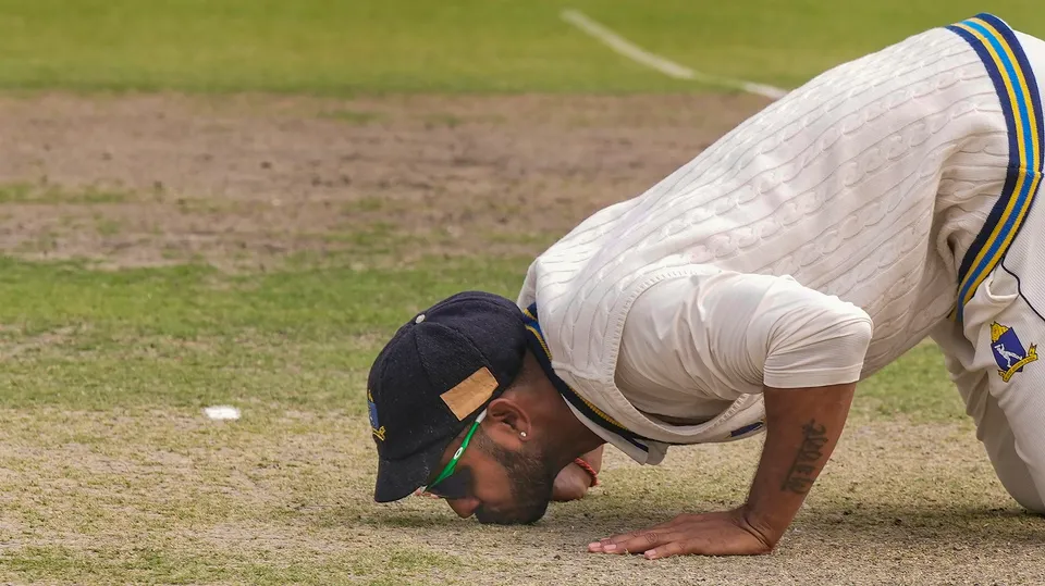 Bengal skipper Manoj Tiwary kisses the pitch after the team's win in the Ranji Trophy match against Bihar at Eden Garden in Kolkata