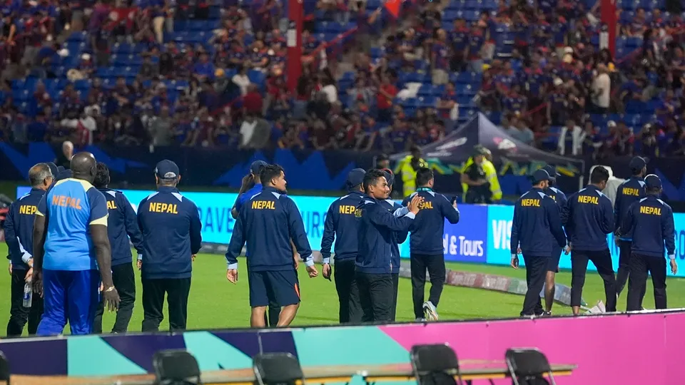 Nepal players walk around the field and gesture to fans after their men's T20 World Cup cricket match against Sri Lanka was abandoned due to rain at Central Broward Regional Park Stadium, Lauderhill, Florida, Tuesday, June 11, 2024.