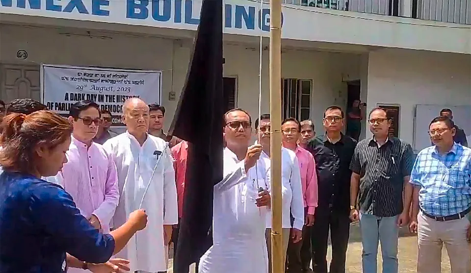 Congress leaders hoist a black flag to protest over the one-day session of the Manipur Assembly, in Imphal