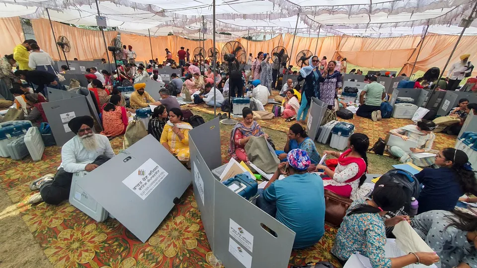 Polling officials check the election material at a distribution center before leaving for their respective polling stations, on the eve of the seventh phase of Lok Sabha elections, in Amritsar, Friday, May 31, 2024
