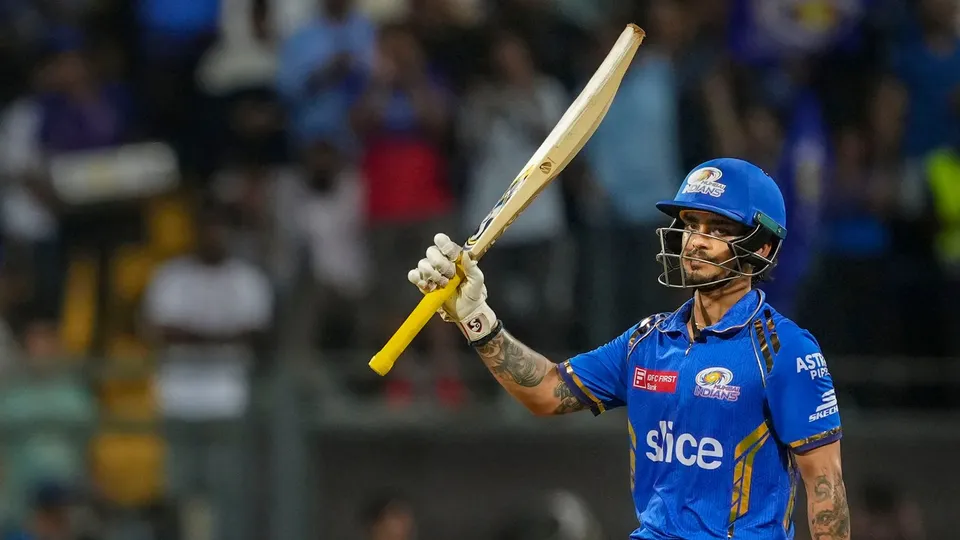 Mumbai Indians' Ishan Kishan celebrates scoring fifty runs during the IPL 2024 cricket match against Royal Challengers Bengaluru and Mumbai Indians at Wankhede Stadium, in Mumbai, Thursday, April 11, 2024