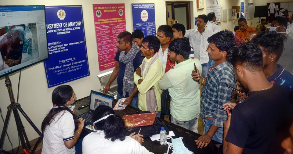 Family members during identification of deceased passengers from the recent triple-train accident, at the AIIMS helpdesk, in Bhubaneswar