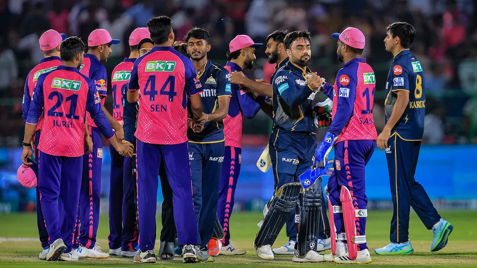 Gujarat Titans' Rashid Khan being congratulated by Rajasthan Royals' captain Sanju Samson after Gujarat beat RR at Sawai Mansingh Stadium, in Jaipur, Wednesday, April 10, 2024