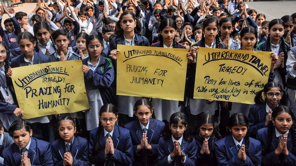 Moradabad school students pray for the workers trapped inside an under-construction tunnel in Uttarakhand Wednesday, Nov. 22, 2023.