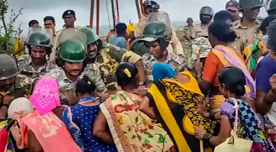 Police personnel attempt to stop local women of Barsu village during the latter's protest against the petrochemical refinery project in the area, at Rajapur taluka in Ratnagiri district
