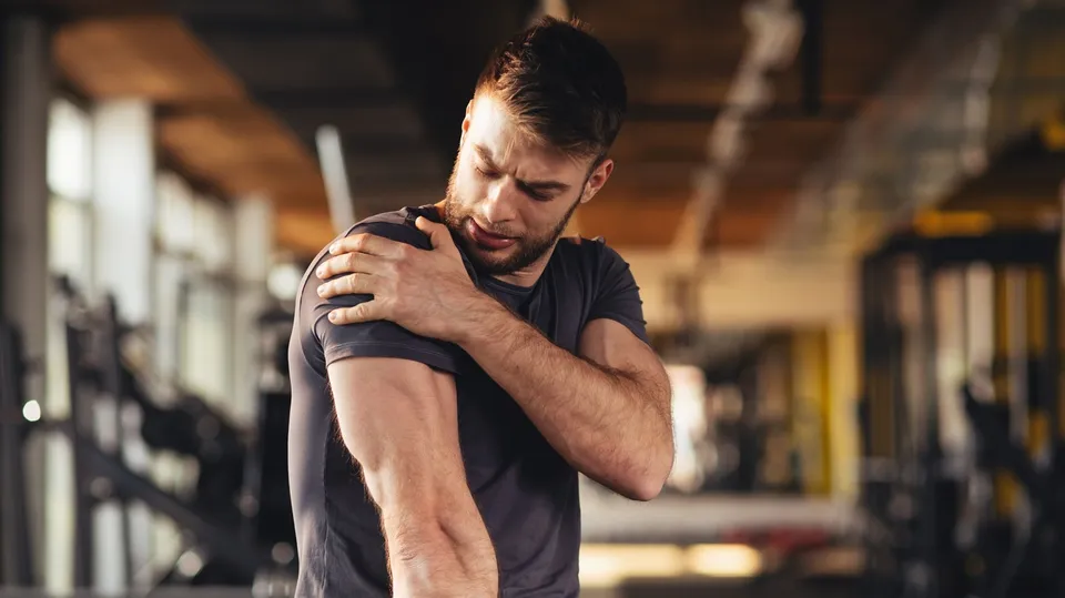 man muscles sore after exercise