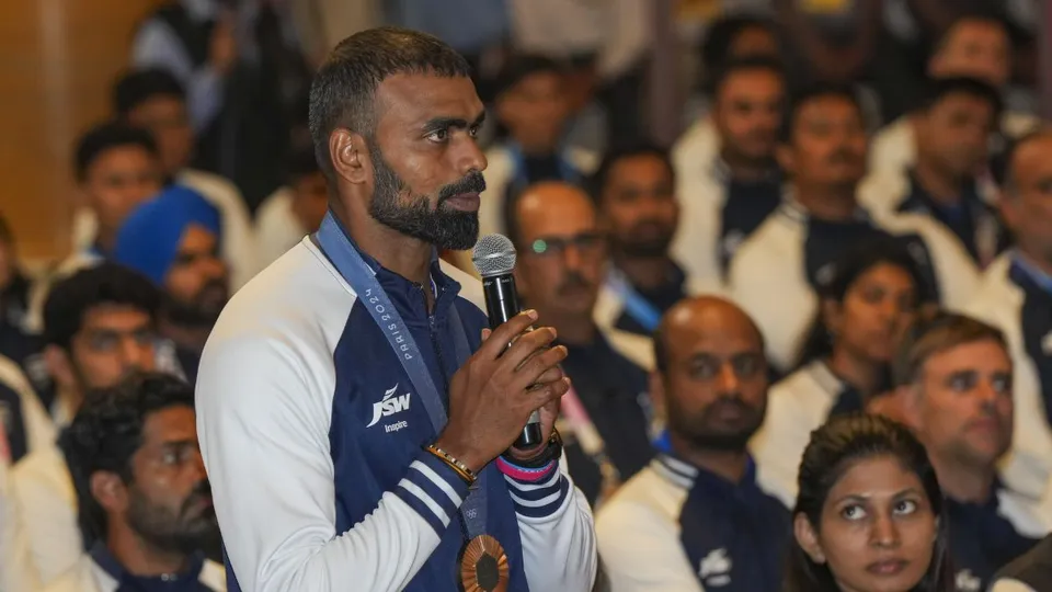 Olympic medal winning hockey player Sreejesh during a meeting with President Droupadi Murmu at the Rashtrapati Bhavan, in New Delhi, Wednesday, Aug. 14, 2024