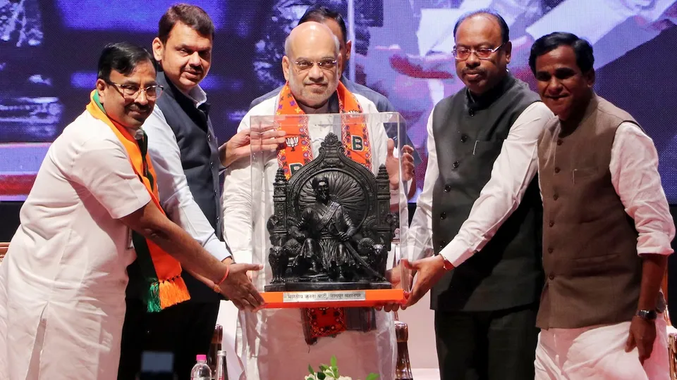 Union Home Minister Amit Shah being felicitated by Maharashtra DCM Devendra Fadnavis and Maharashtra BJP President Chandrashekhar Bawankule and others during Bharatiya Janata Partys Vidarbha region workers meeting, in Nagpur, Tuesday, Sept. 24, 2024.
