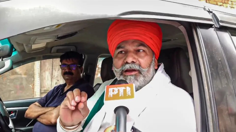 Farmer leader Rakesh Tikait speaks with the media upon his arrival in Hathras, Monday, July 8, 2024.