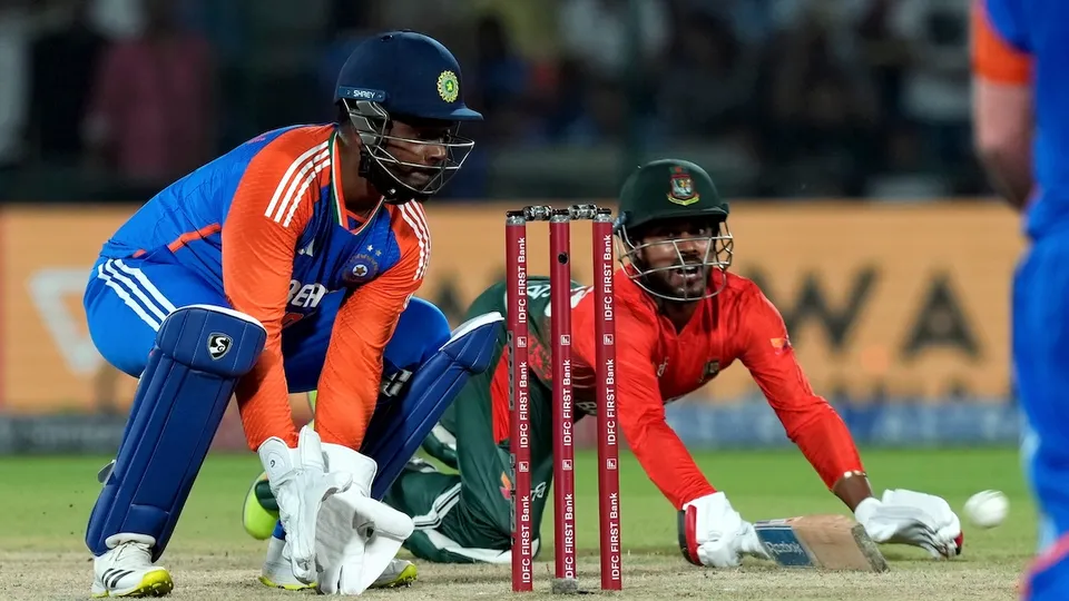 Bangladesh's Mehidy Hasan Miraz successfully reaches the crease during the second T20 International cricket match between India and Bangladesh at the Arun Jaitley Stadium, in New Delhi, Wednesday, Oct. 9, 2024.
