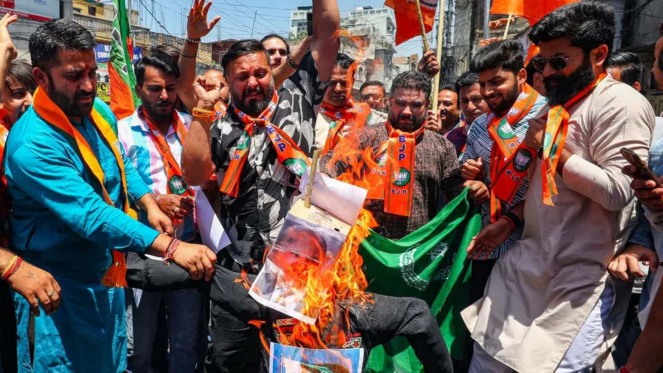 Bharatiya Janata Yuva Morcha (BJYM) members burn an effigy representing Pakistan after a terrorists attack in Kashmir in which a Sarpanch was killed in Jammu, Sunday, May 19, 2024