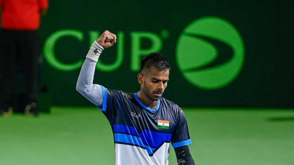 India's Sumit Nagal celebrates after winning the match against Morocco's Adam Moundir in the second singles of the Davis Cup World Group-II tie, in Lucknow