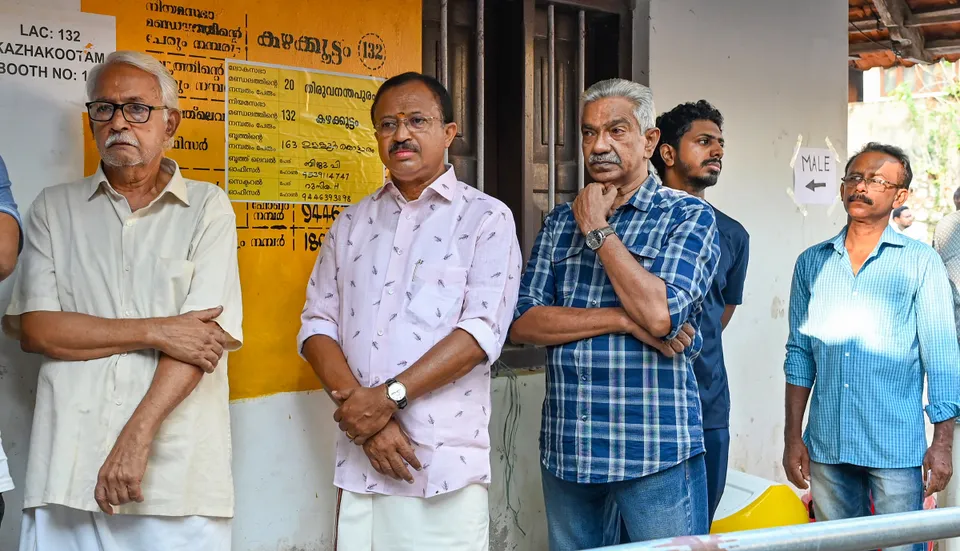 Union Minister V Muraleedharan stand in queue at polling centre in Kerala