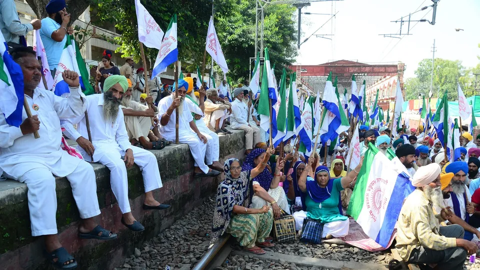 Farmers block railway tracks during a protest against central and state government, in Jalandhar