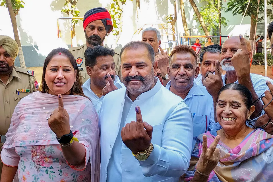 AAP candidate Sushil Rinku along with his family members after casting votes for Jalandhar seat Lok Sabha by-election, in Jalandhar