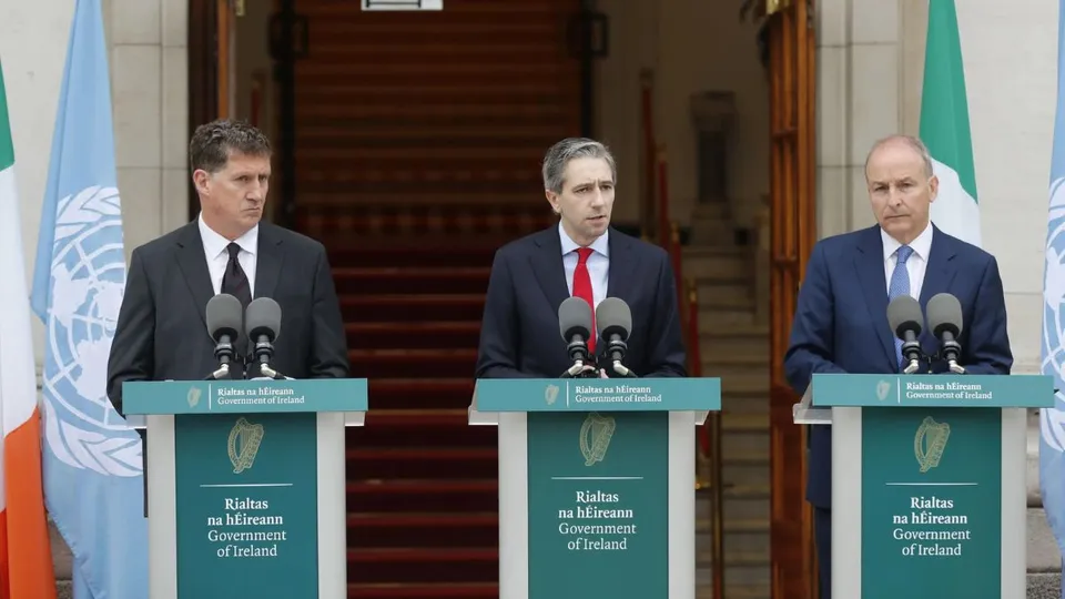 The three Irish Government leaders from left, Minister Eamon Ryan, Taoiseach Simon Harris and Tanaiste Micheal Martin speak to the media during a press conference outside the Government Buildings, in Dublin, Ireland, Wednesday May 22, 2024