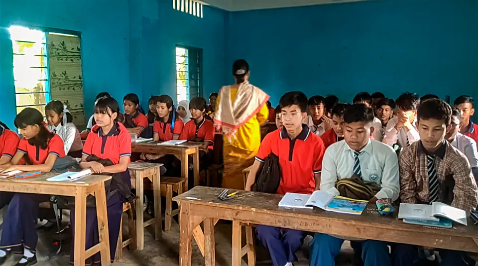 Students attend a class at a school that reopened after remaining shut for months because of ethnic clashes in Manipur