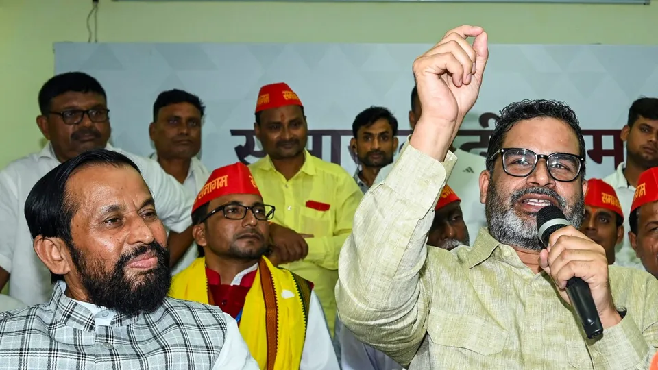 Jan Suraaj convenor Prashant Kishor along with newly joined party leader Devendra Prasad Yadav during a press conference at Gyan Bhawan, in Patna, Tuesday, Aug. 27, 2024.