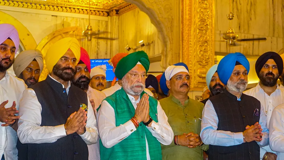 Union Minister Hardeep Puri offers prayers at the Bangla Sahib Gurudwara for the successful landing of ISRO's 'Chandrayaan-3' on the lunar surface of the Moon, at Pandav Nagar in New Delhi