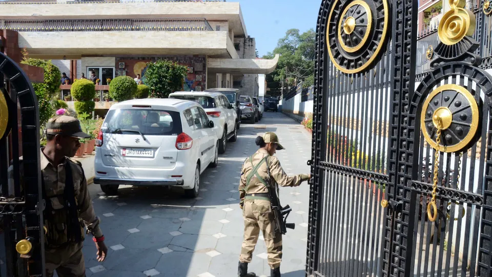 Security personnel during a raid by the Income Tax department on the residence of Congress MP Dhiraj Prasad Sahu in connection with a disproportionate assets case, in Ranchi, Sunday, Dec. 10, 2023.