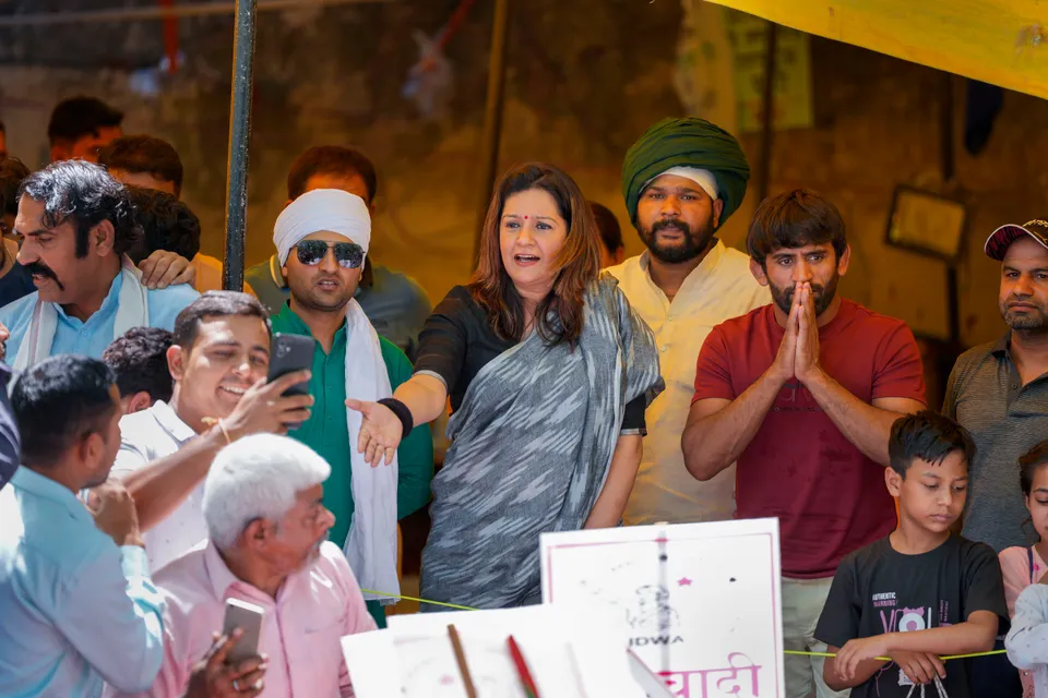 Rajya Sabha MP Priyanka Chaturvedi with wrestler Bajrang Punia during wrestlers' protest at Jantar Mantar