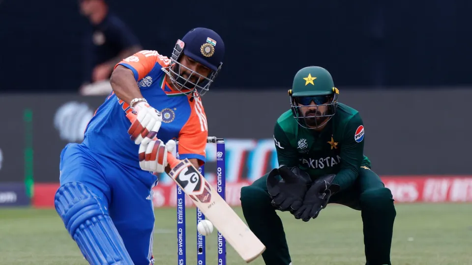 India's Rishabh Pant, left, plays a shot during the ICC Men's T20 World Cup cricket match between India and Pakistan at the Nassau County International Cricket Stadium in Westbury, New York, Sunday, June 9, 2024.