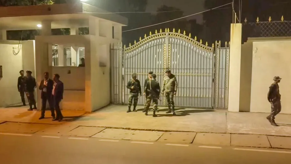 Security personnel stand guard outside the residence of Jharkhand Chief Minister Hemant Soren during his questioning by the Enforcement Directorate (ED) officials in connection with a money laundering case, in Ranchi, Wednesday, Jan. 31, 2024.
