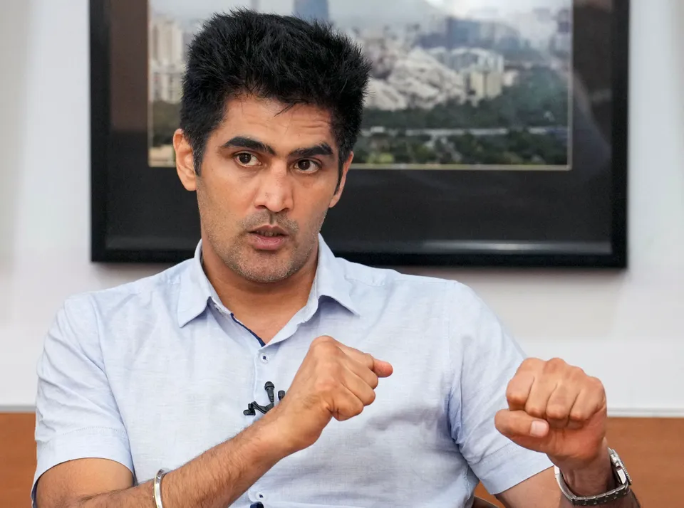 Boxer and BJP leader Vijender Singh speaks during an interview with PTI, in New Delhi, Thursday, July 25, 2024