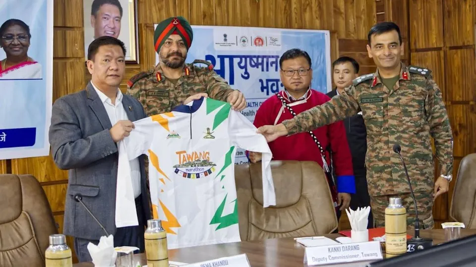 Arunachal Pradesh Chief Minister Pema Khandu displaying jersey for the Tawang Marathon