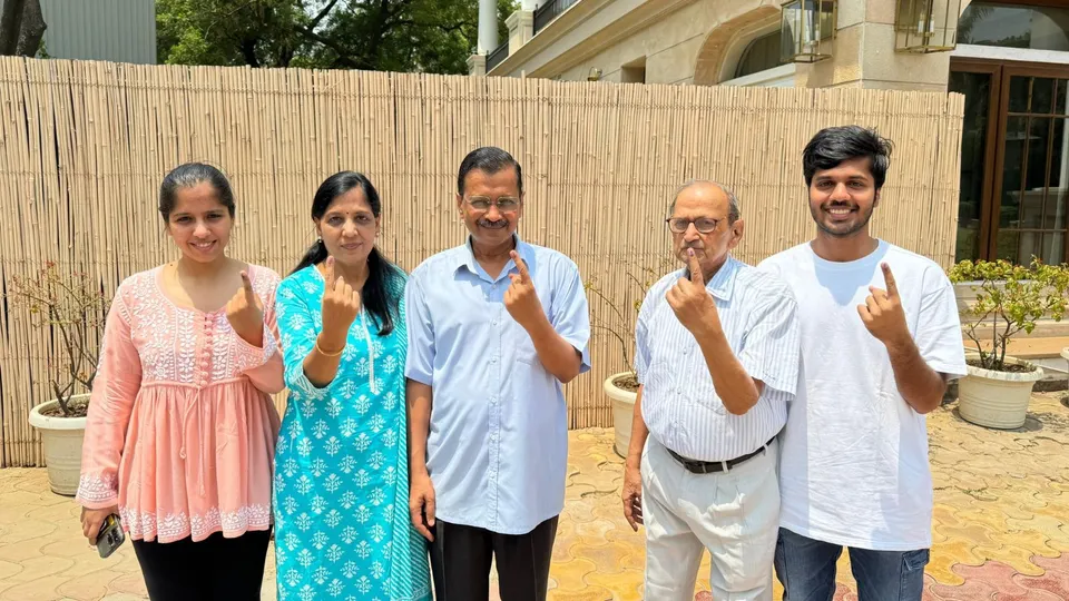 Delhi Chief Minister Arvind Kejriwal with father Gobind Ram Kejriwal and other family members after casting vote, during the sixth phase of Lok Sabha elections, in New Delhi, Saturday, May 25, 2024