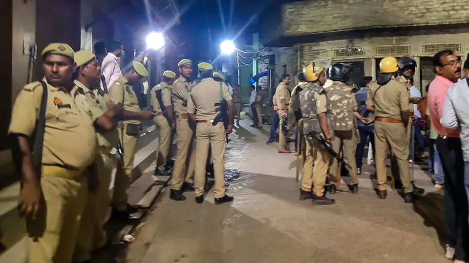 People gather at the residence of the jailed gangster-turned-politician Mukhtar Ansari who died of cardiac arrest in the Banda hospital, in Uttar Pradesh's Ghazipur, Thursday, March 28, 2024