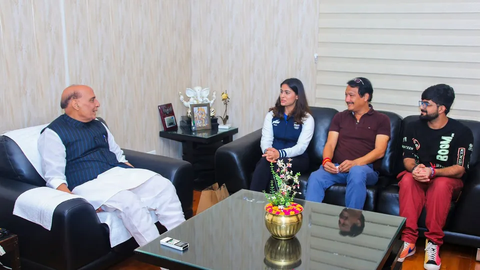 Olympic medal winner Manu Bhaker along with her coach Jaspal Rana meets Union Defence Minister Rajnath Singh, in New Delhi, Thursday, Aug. 8, 2024.