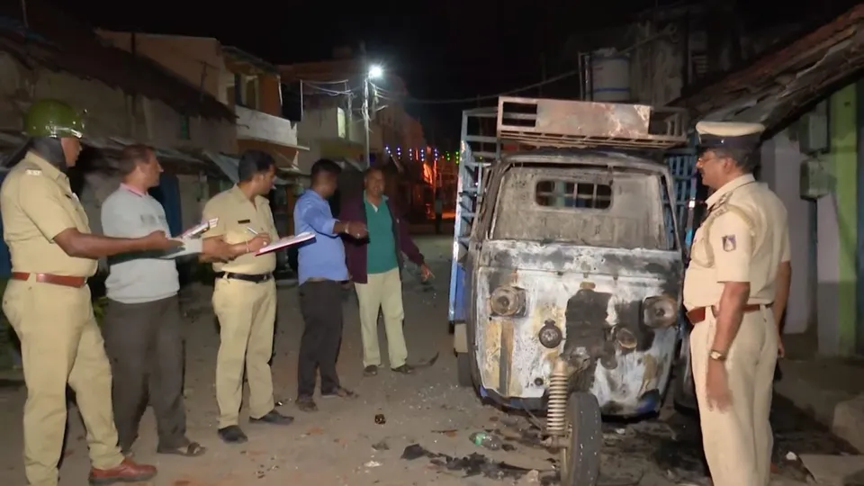Security personnel investigate following clashes between two groups during a Ganesh Chaturthi procession, at Nagamangala in Mandya district, Wednesday night, Sept. 11, 2024.