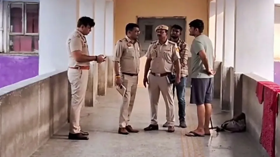 Police personnel investigate after a patient was shot dead at GTB hospital, in New Delhi