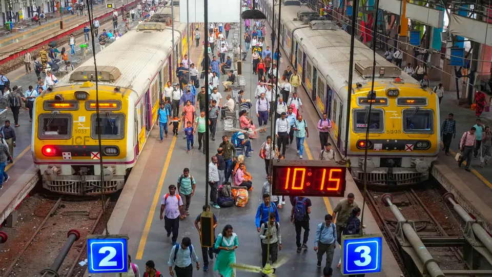 Commuters get off trains during the rush hour at Churchgate Station in Mumbai