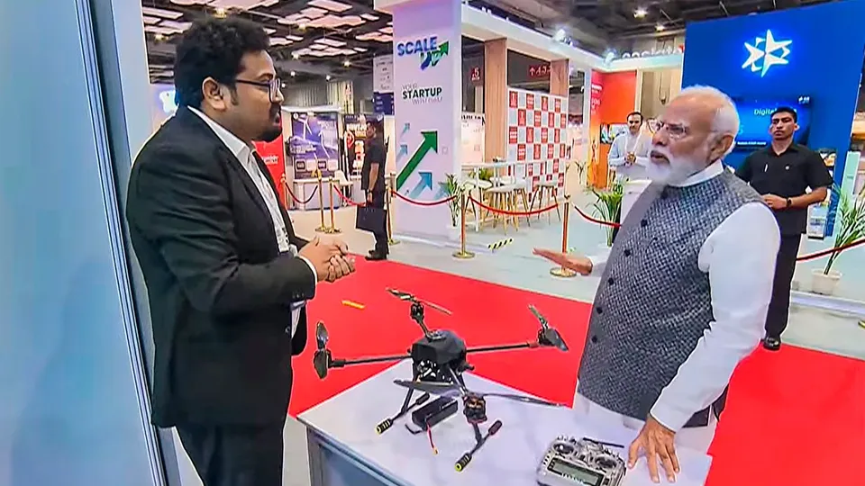 Prime Minister Narendra Modi visits a stall during the inauguration of Start-up Mahakumbh at the Bharat Mandapam