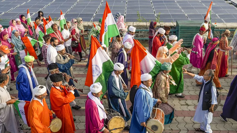 Traditional Kashmiri dancers take part in a 'Tiranga Rally'